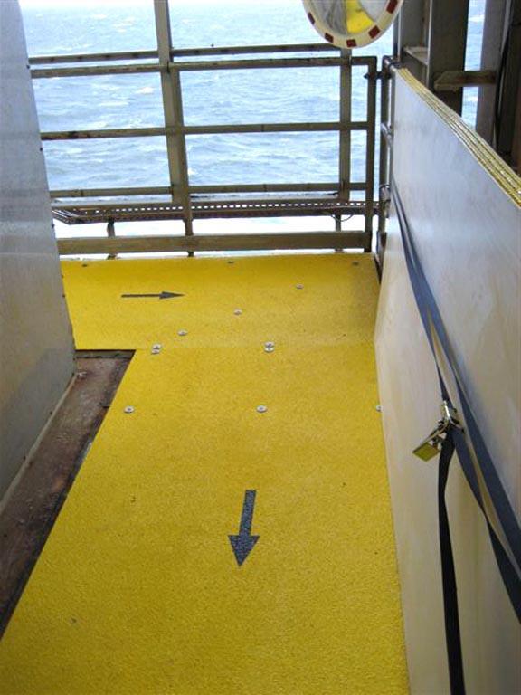 Yellow anti-slip Walkway cover with Black arrows on vessel